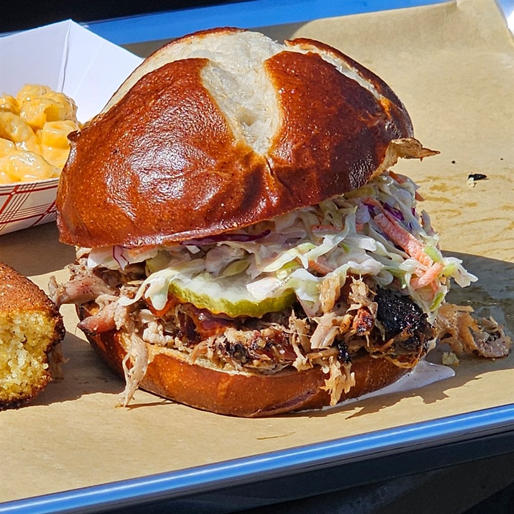 Smoked Pulled Pork Sandwich on Pretzel Bun — Eager Beaver BBQ